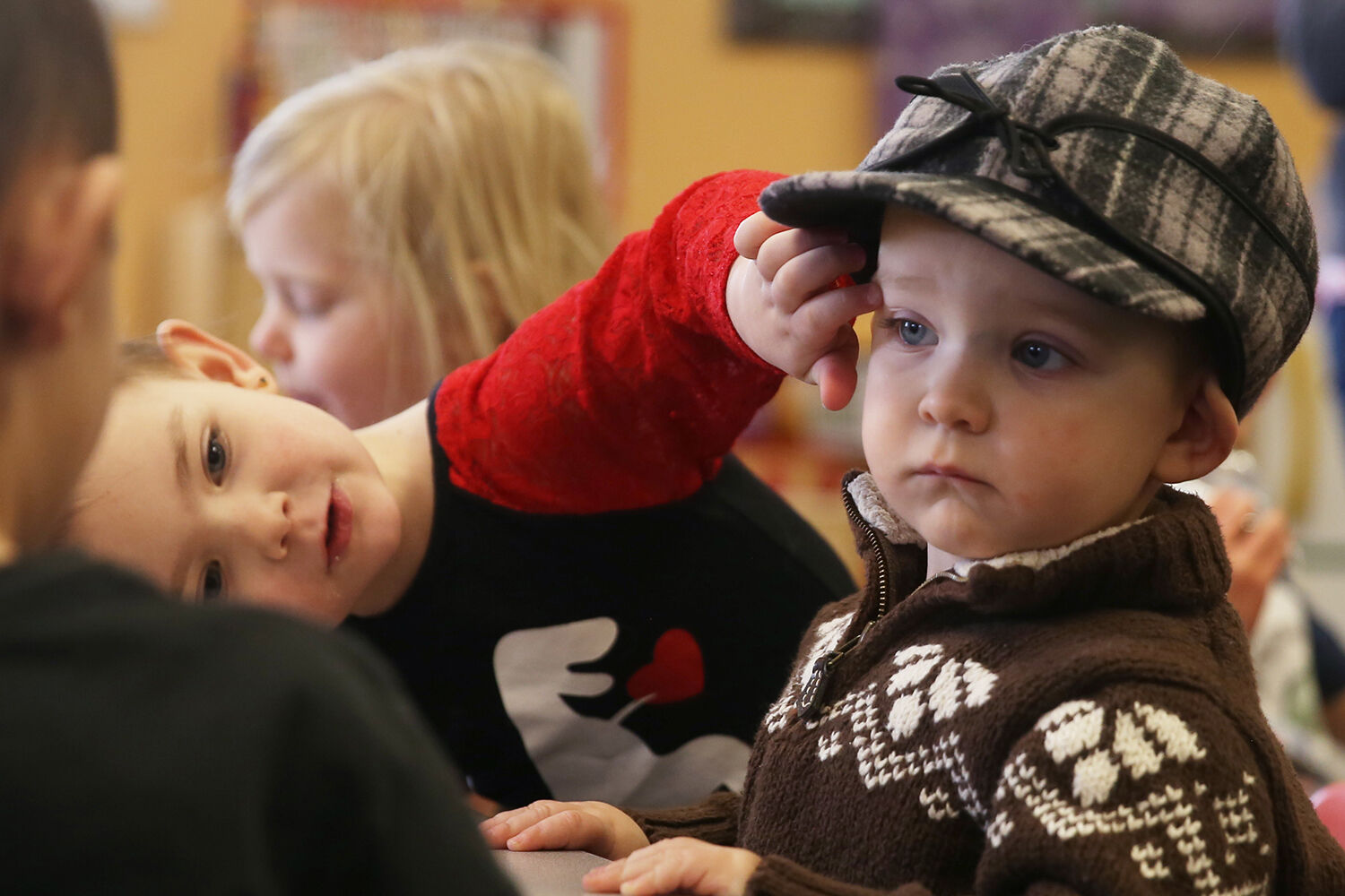 Brynlie Goodson, 4, rubs the cheeks of her brother Brayzen